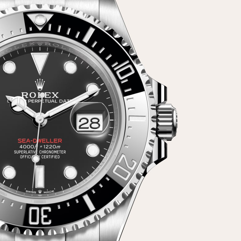 ด้านหน้า Rolex Sea-Dweller ในวัสดุ Oystersteel, m126600-0002 กับเหรียญรับประกันสีเขียว - นำสว่าง
