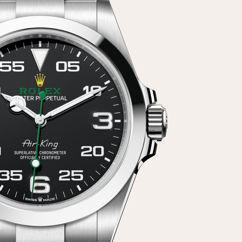 ด้านหน้า Rolex Air-King ในวัสดุ Oystersteel, m126900-0001 กับเหรียญรับประกันสีเขียว - นำสว่าง