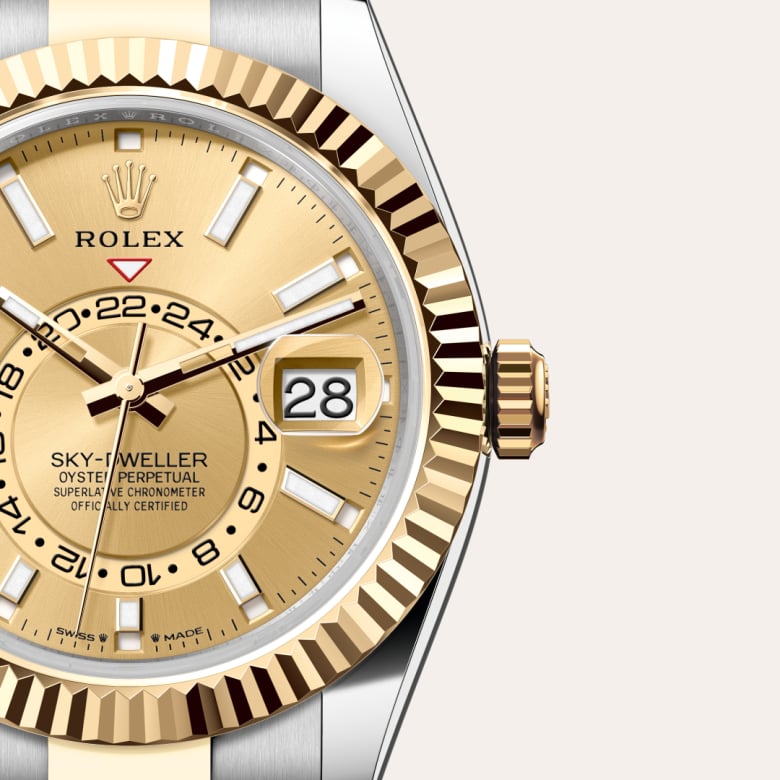 ด้านหน้า Rolex Sky-Dweller ในวัสดุ Yellow Rolesor, m336933-0001 กับเหรียญรับประกันสีเขียว - นำสว่าง