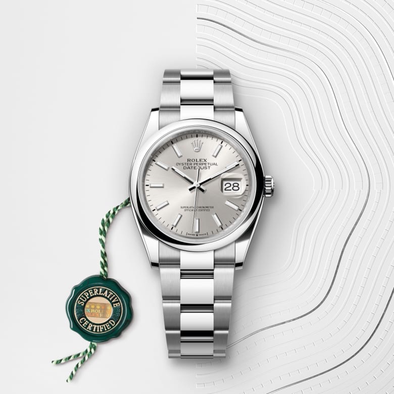 ด้านหน้า Rolex Datejust ในวัสดุ Oystersteel, m126200-0002 กับเหรียญรับประกันสีเขียว - นำสว่าง