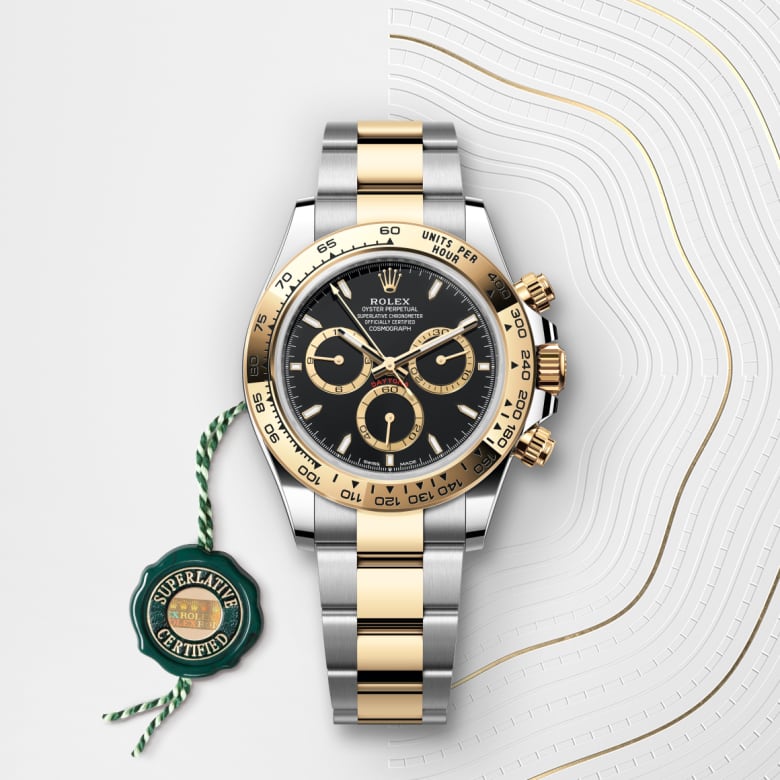 ด้านหน้า Rolex Cosmograph Daytona ในวัสดุ Yellow Rolesor - การผสมผสานระหว่าง Oystersteel และทองคำ, m126503-0003 กับเหรียญรับประกันสีเขียว - นำสว่าง