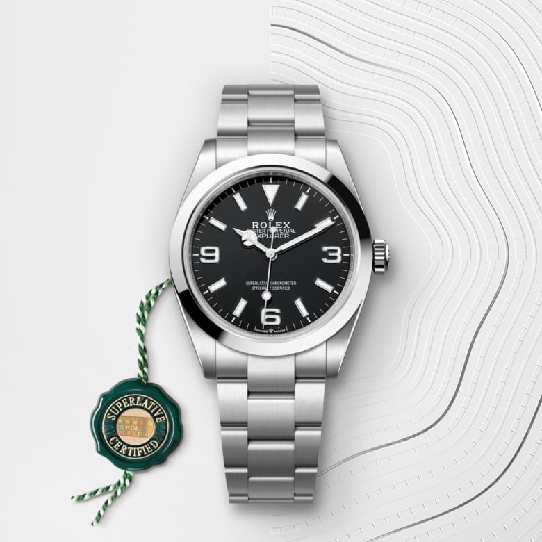 ด้านหน้า Rolex Explorer ในวัสดุ Oystersteel, m224270-0001 กับเหรียญรับประกันสีเขียว - นำสว่าง